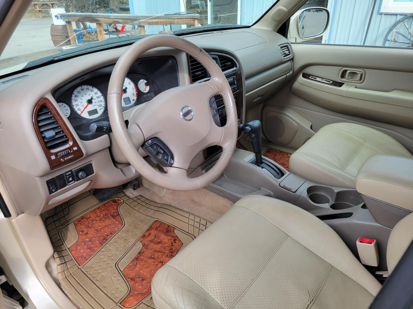 2002 Gold /Tan Nissan Pathfinder LE (JN8DR09Y22W) with an 3.5L v6 engine, Automatic transmission, located at 450 N Russell, Missoula, MT, 59801, (406) 543-6600, 46.874496, -114.017433 - 4WD SUV. 3.5L V6. Automatic Transmission. Heated Seats. Power Leather Seats. Power Sunroof. Air. Cruise. Tilt. AM FM CD Player. Power Windows and Locks. Because of the age, Financing is not available on this vehicle. - Photo#12